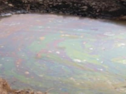 An oil slick on top of groundwater.